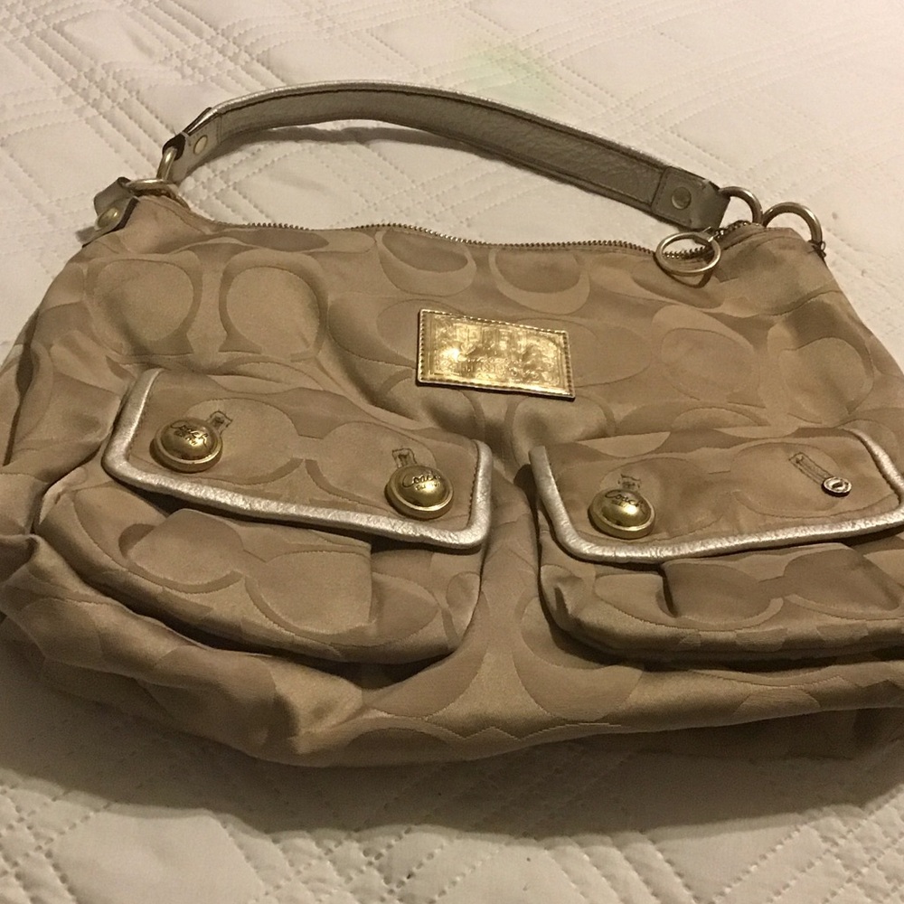 Coach Tan Signature Canvas Shoulder Bag It’s missing a button